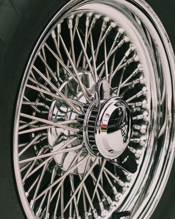Detailed view of a classic car's chrome wheel in Montreal, Quebec.